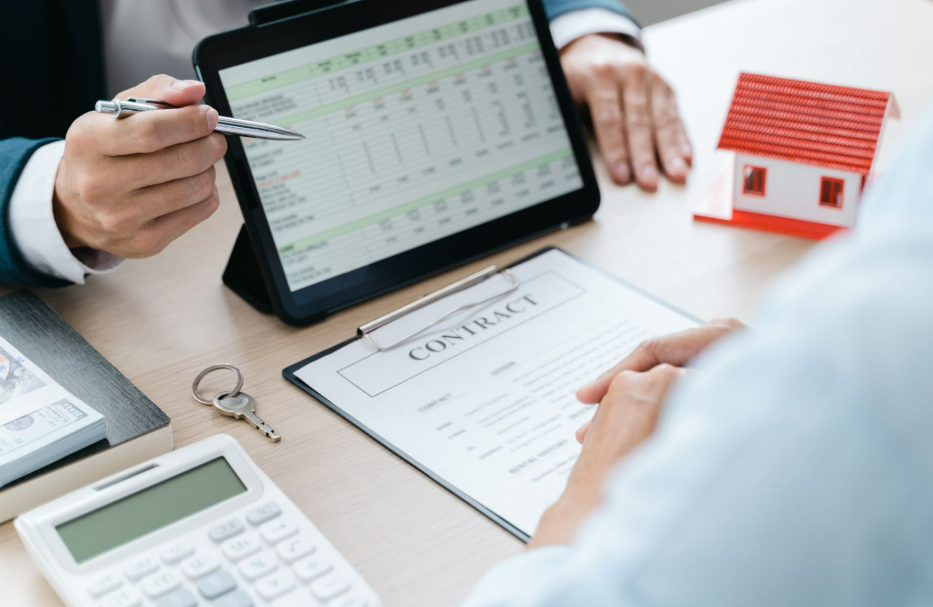 A close-up of a professional real estate consultation