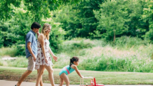 Family Walking in a Green Park at Magnolia Place in Magnolia, Texas