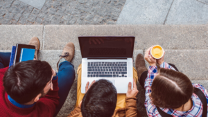 Students Collaborating on Laptop Outdoors in Magnolia Place, Magnolia, Texas