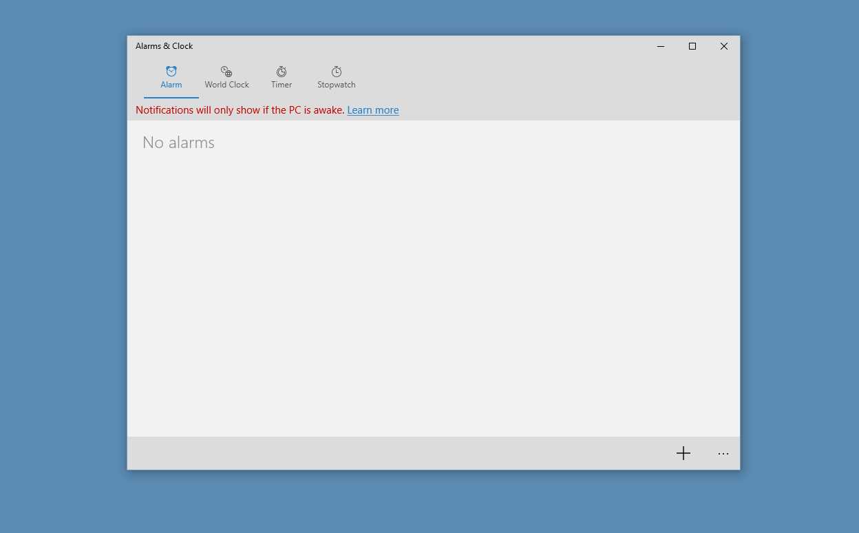 The Alarms & Clock application at the center of the screen