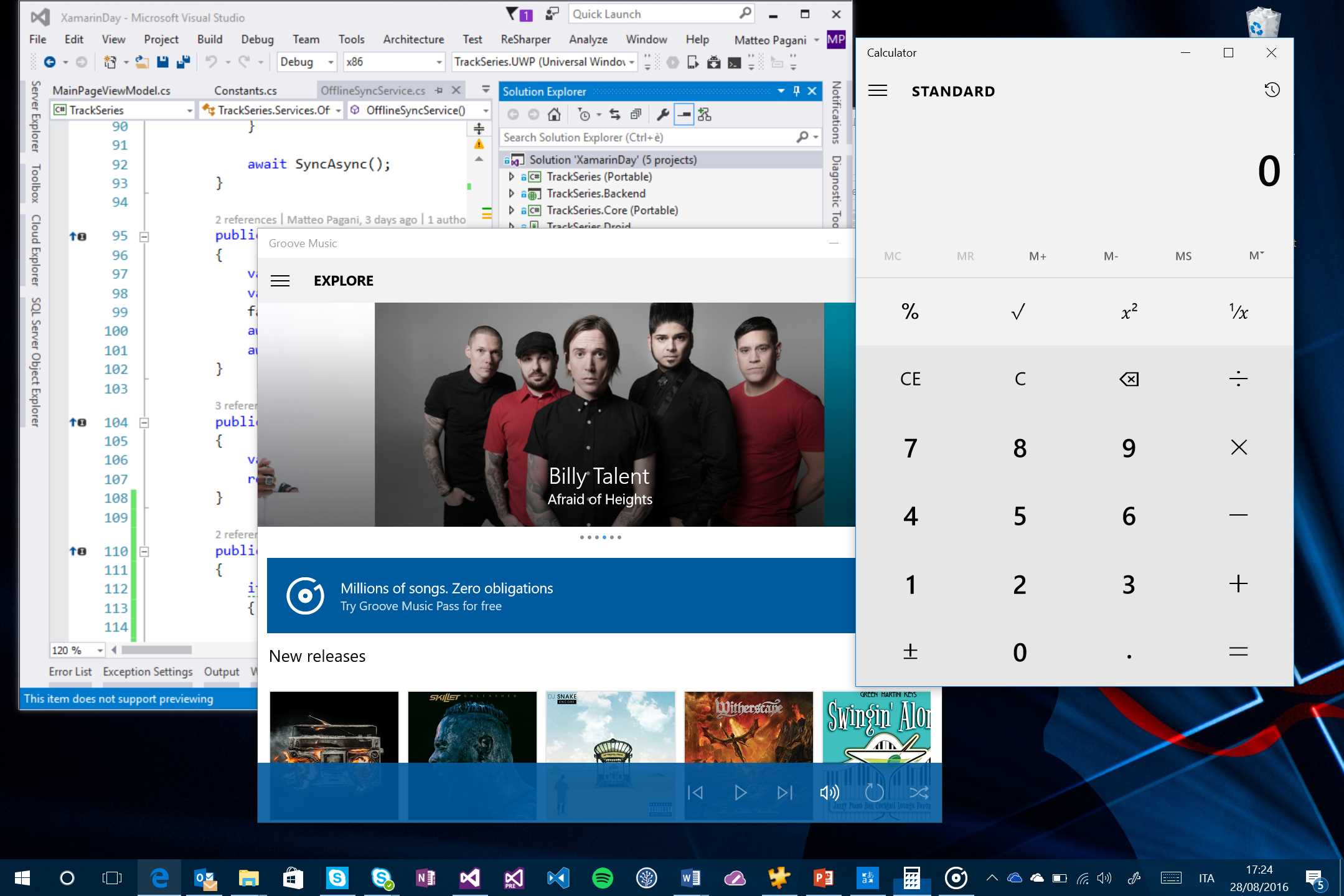 Visual Studio, which is a traditional desktop application, running side-by-side with two Universal Windows Platform apps