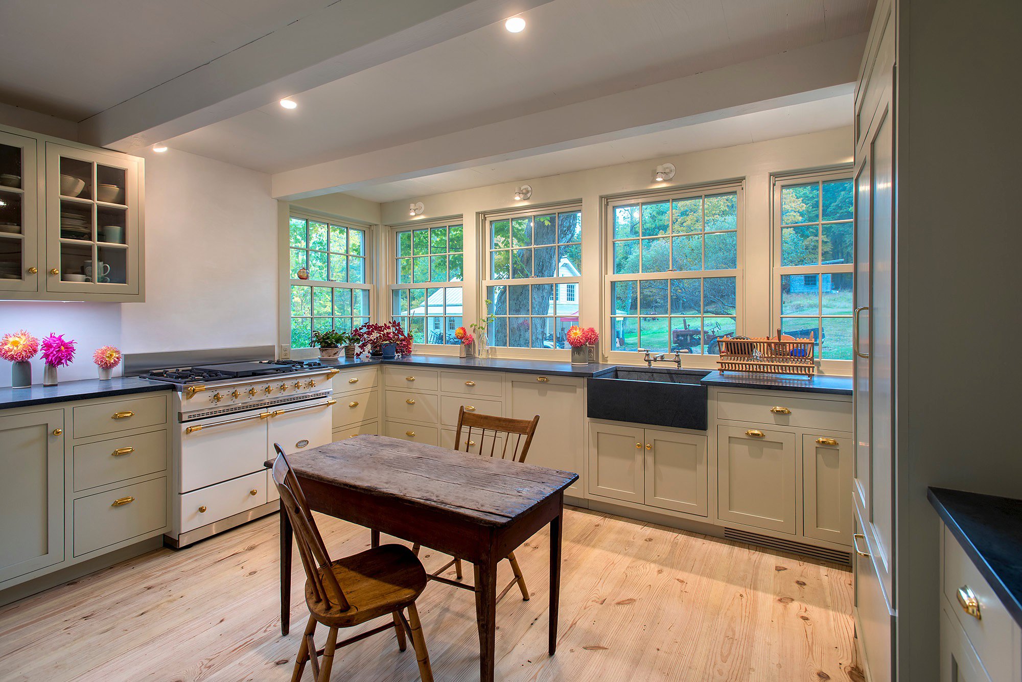 Vernacular Design completely restored this eyebrow colonial in Stone Ridge after a fire. The owners used the opportunity to create a new kitchen and primary bedroom addition. The cabinets were made to match the owner’s favorite designs.