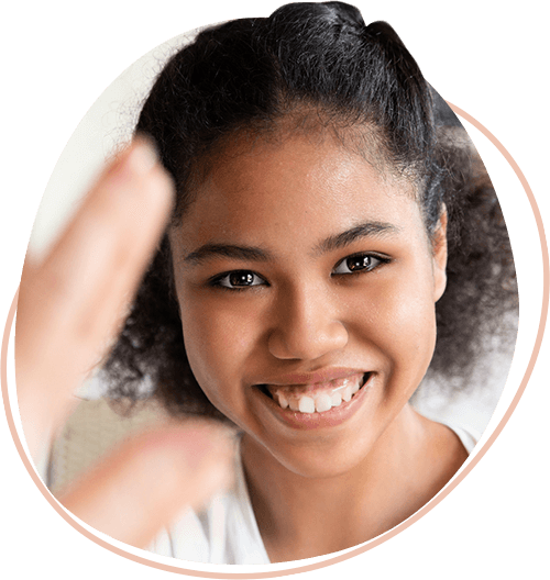Young-African-American-girl-smiling-widely-at-the-viewer.png
