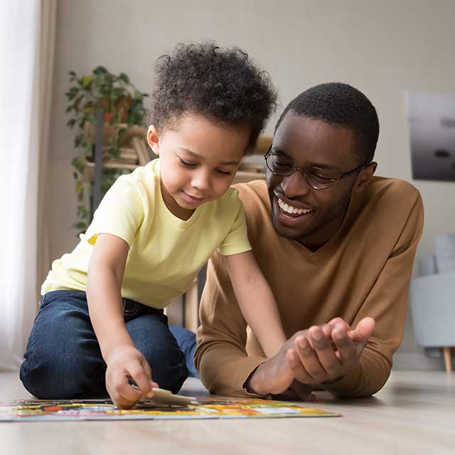 Young boy doing puzzle