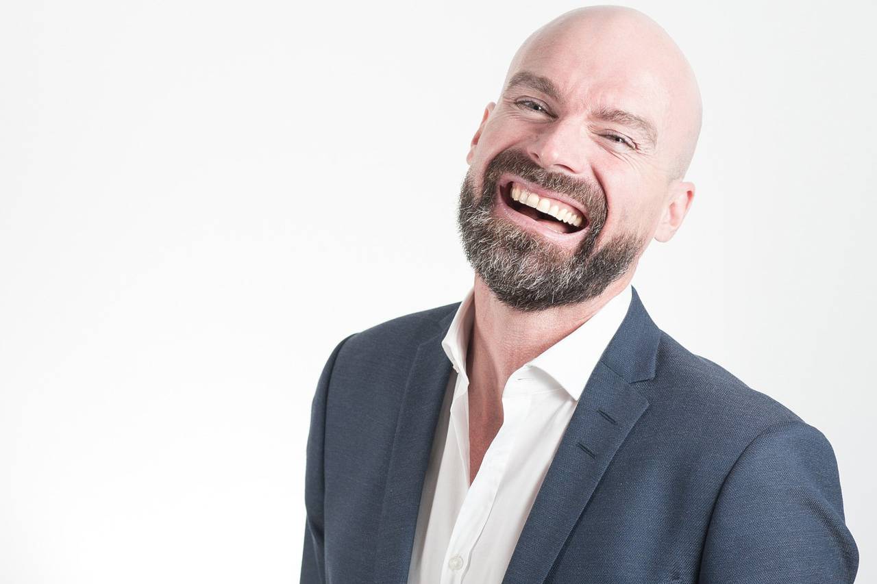 Man Wearing Suit Laughing 1280×853.jpg