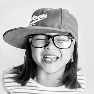 Eye care, Happy girl, wearing cap and eyeglasses in Round Rock, TX