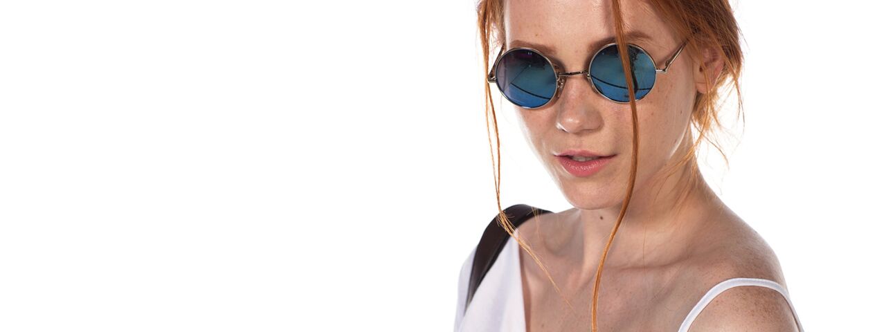 Woman Redhead Sunglasses at TotalVision in Connecticut