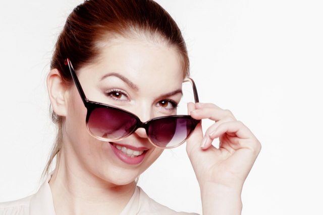 Woman wearing prescription sunglasses at TotalVision in Connecticut