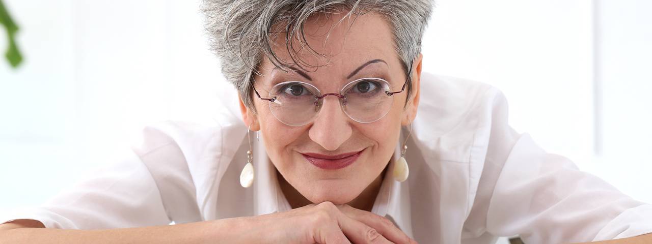 Woman wearing prescription glasses, Eye Care in Billings, Montana