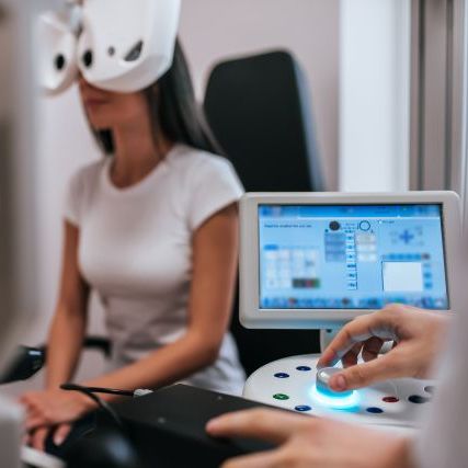 Doctor And Patient In Ophthalmology Clinic