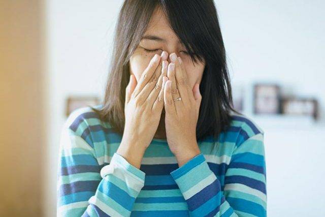 Optometrist, asian woman suffering from eye allergies in San Antonio, Texas