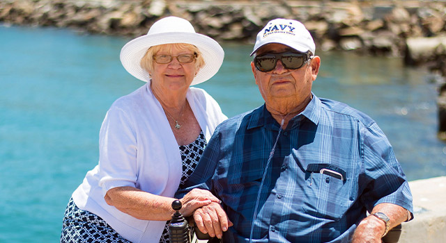senior couple by the water