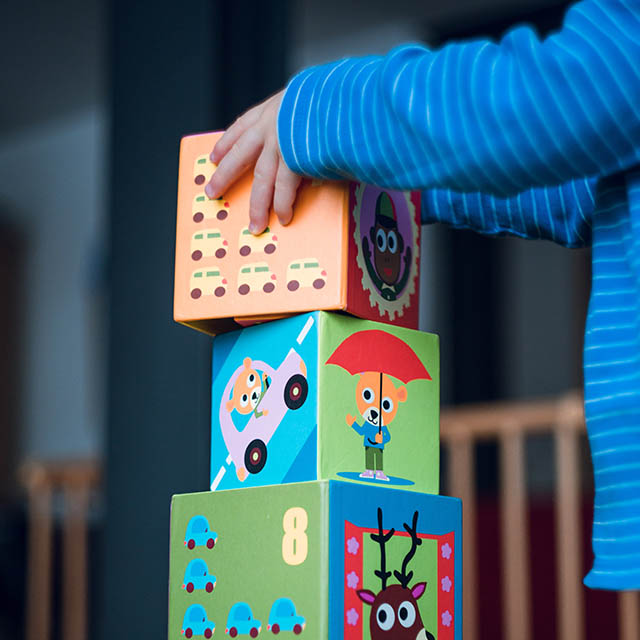 child in kindergarten, with blocks