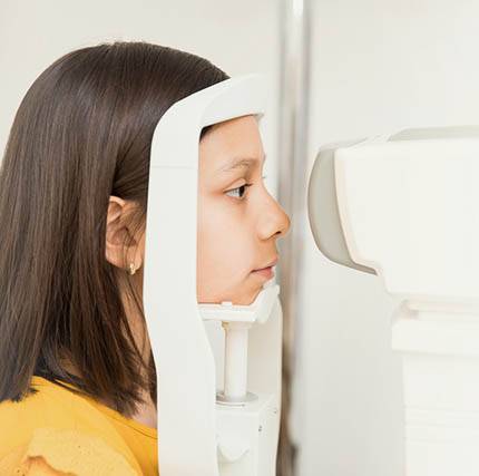 Closeup Portrait Of Beautiful Girl Having Eye Sight Testing At O