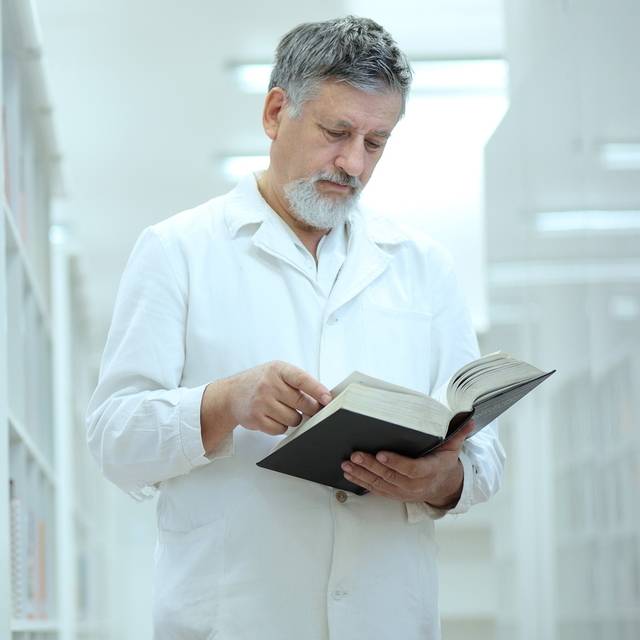 Renowned scientist/doctor in a library of research center/hospit