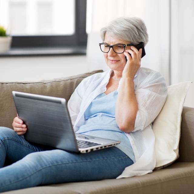 technology, old age and people concept happy senior woman in g