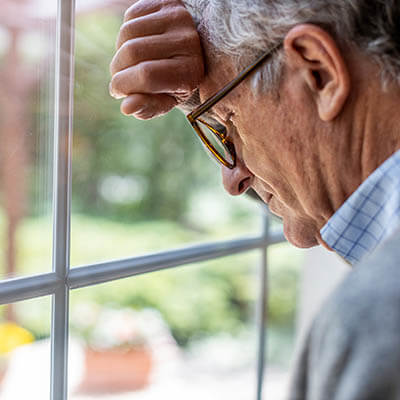 Depressed senior man in isolation at home for virus outbreak