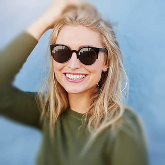 woman wearing designer sunglasses in Great Neck and Plainview, New York