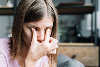 Woman's Eye in Ad for Eye Care Emergencies