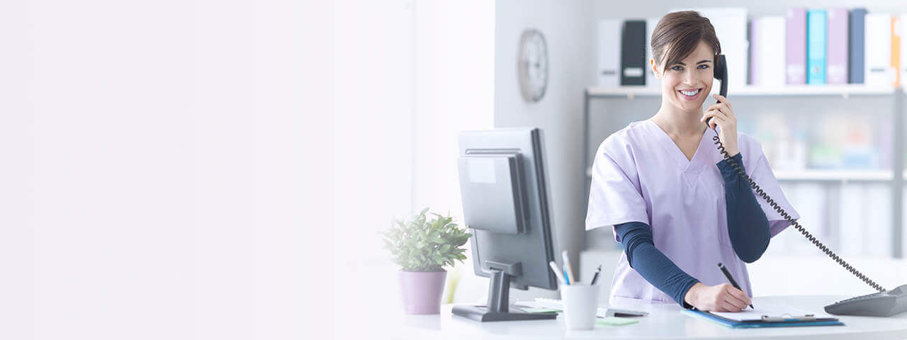 Smiling Receptionist At The Clinic