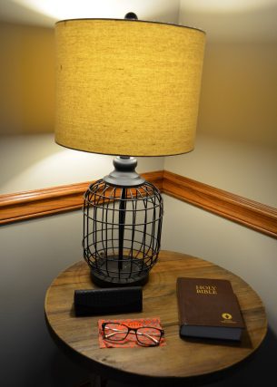 bible and eyeglasses under the lamp