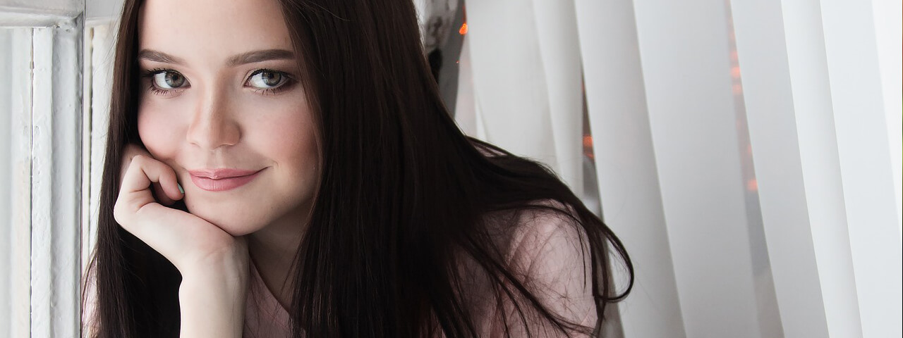 Teen-Girl-Smiling-Window-1280x480