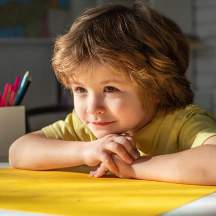 Cute Face Of Pupil, Close Up. Elementary School Classroom. Child