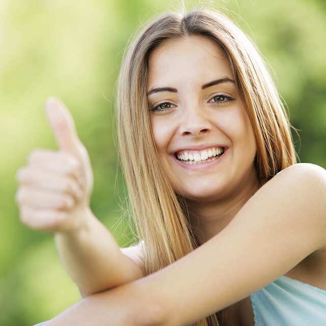 caucasian girl smiling after LASIK surgery