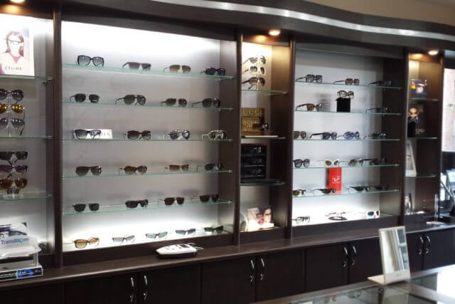 optician holding eyeglasses