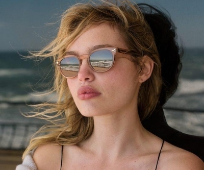 Model wearing Oliver Peoples sunglasses