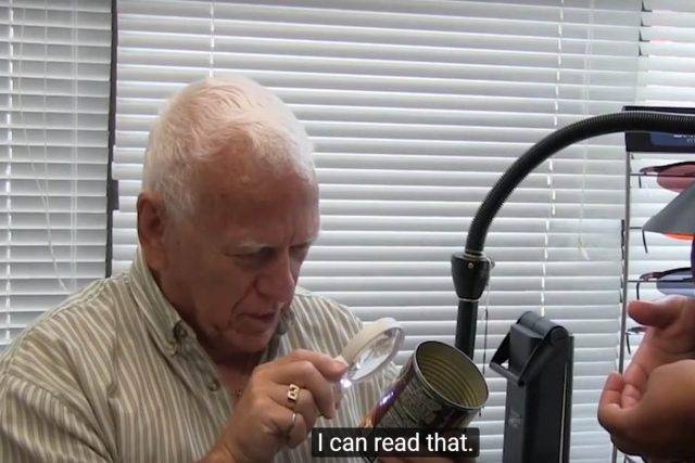 man using low vision wall scanning device