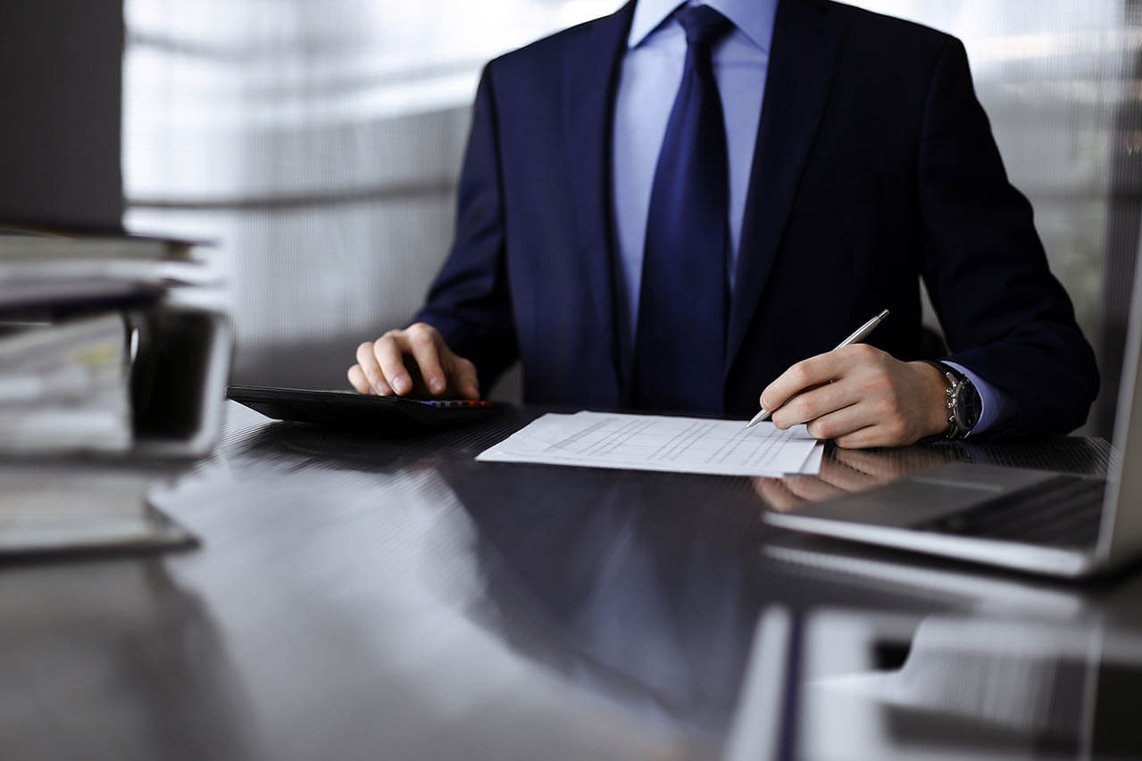 Unknown Man Accountant In Blue Blazer Use Calculator And Compute