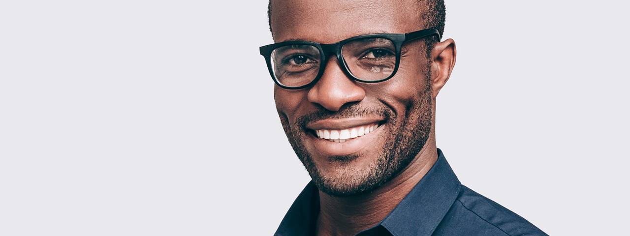 Optometrist, man smiling with eyeglasses in Hartsdale, NY