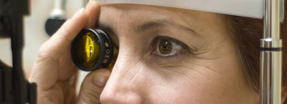 Optometrist, woman at an eye exam for contact lenses in Winter Park, FL