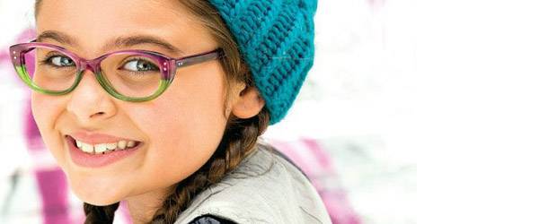 Girl showing off her new eyeglasses