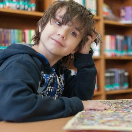 child library smiling reading 640px.jpg
