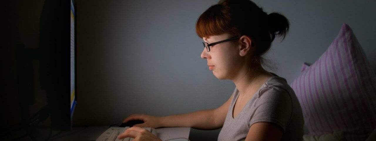 Woman wearing computer glasses while working