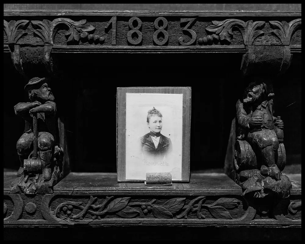 Photos of ancestors adorn 19th-century foudres in the Kuentz-Bas cellar