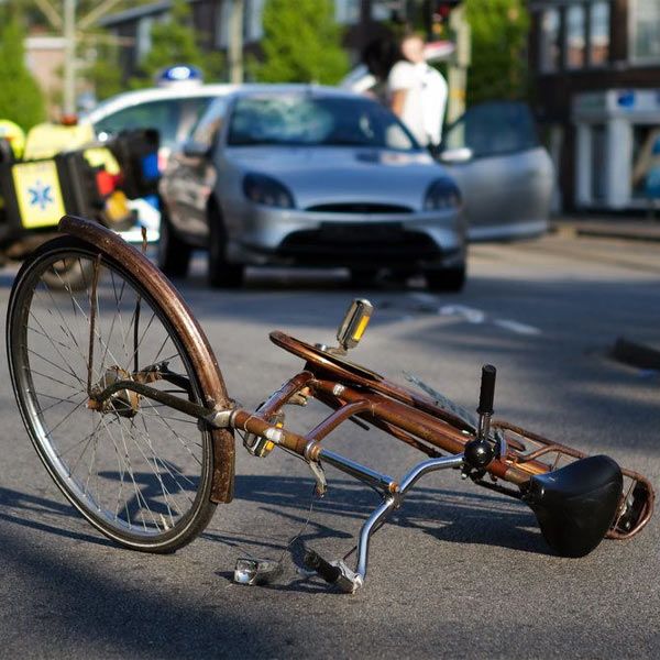 Bicycle lying on road