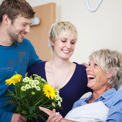 Smiling mom with adult children