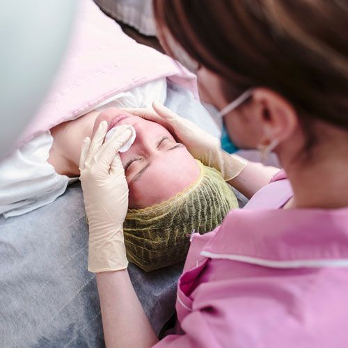 Woman receiving chemical peel