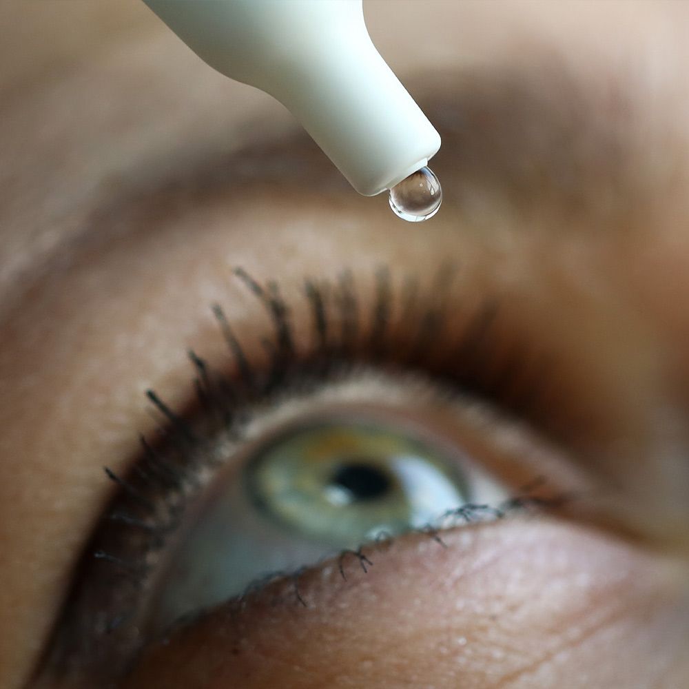eye drops being administered