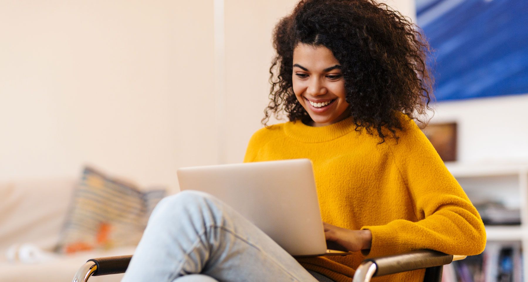 Smiling woman using laptop