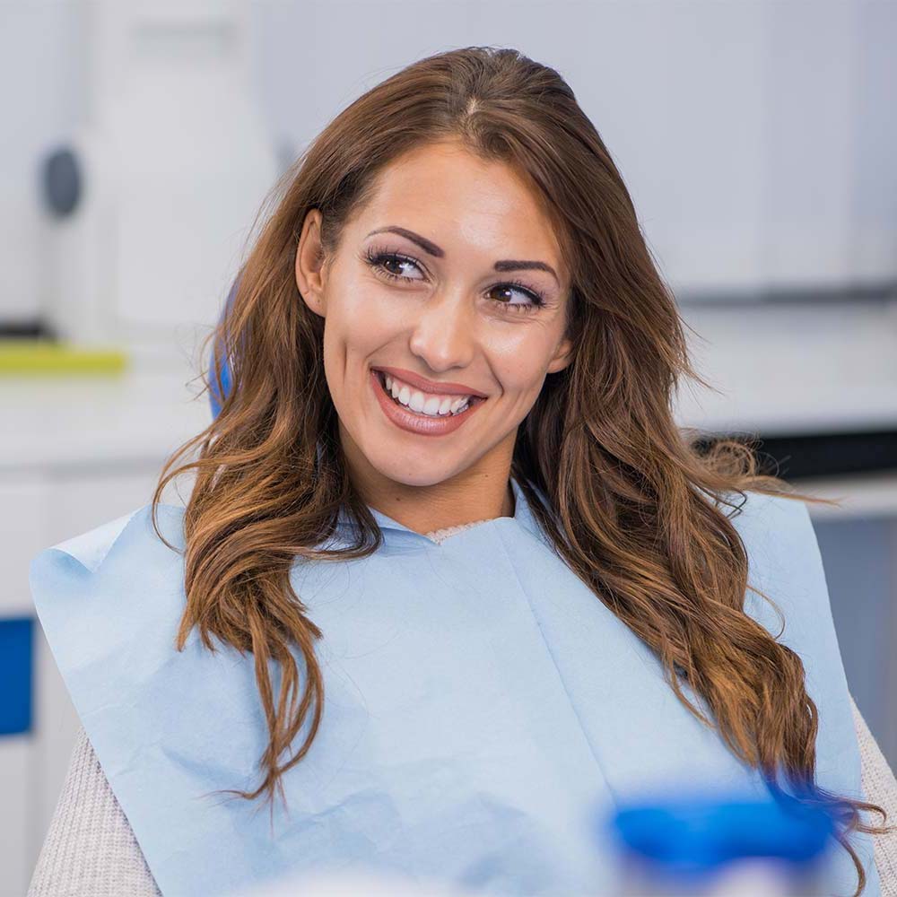 Woman wearing dental bib