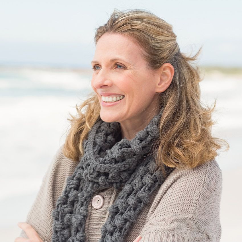 Smiling blonde woman looking into distance
