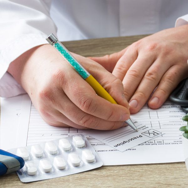 Doctor writing prescription