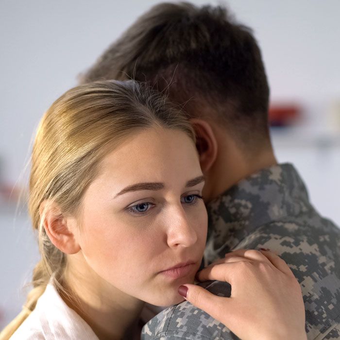 Woman hugging military spouse