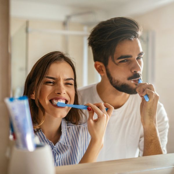People brushing their teeth