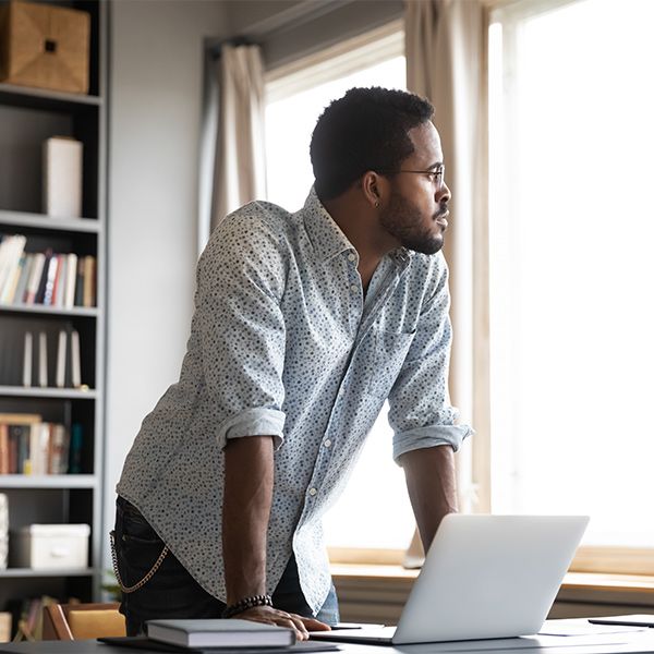 man looking out the window