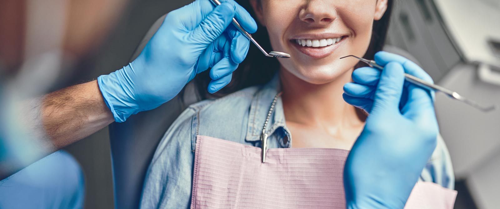 Dentist examining patient's mouth